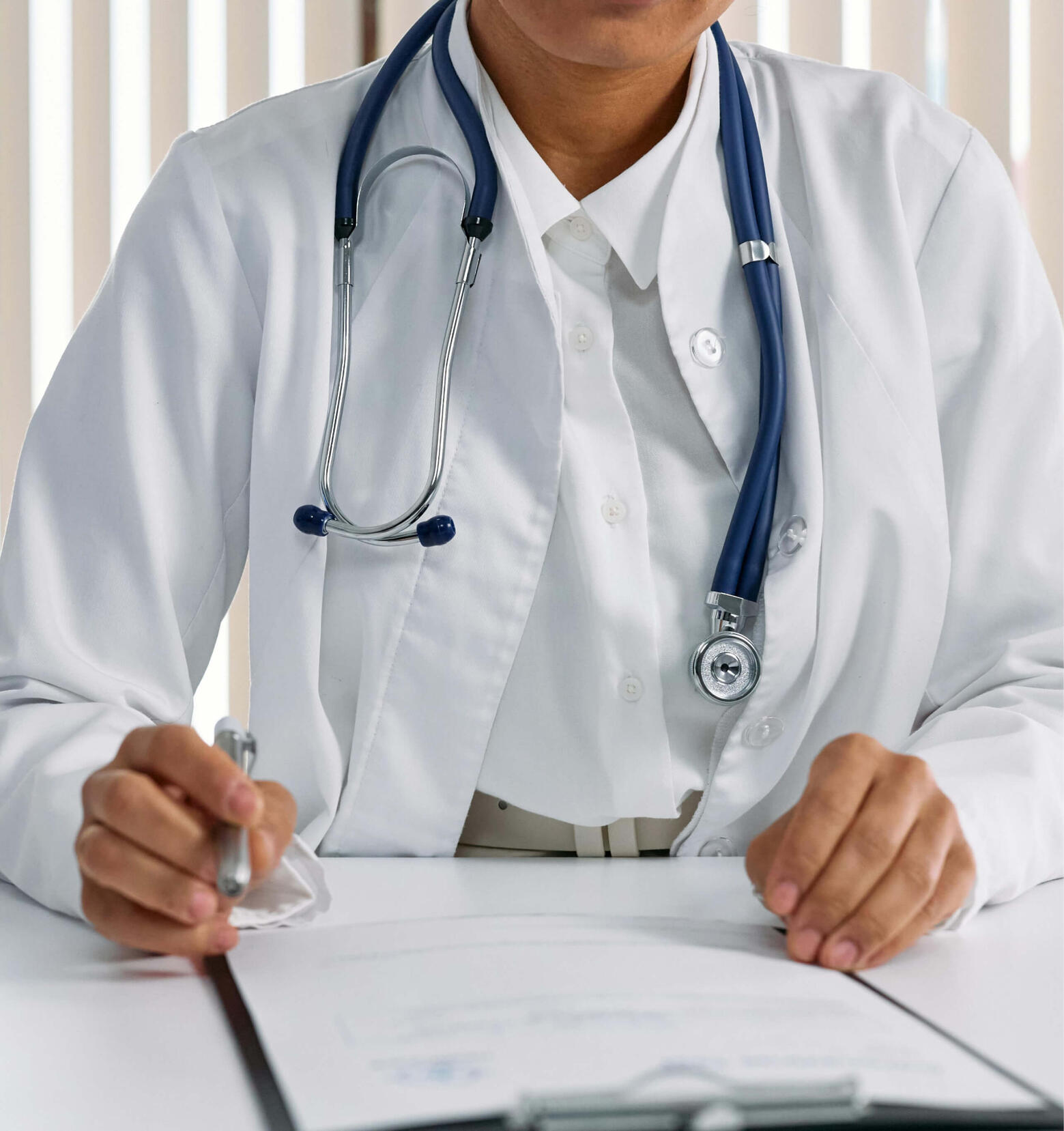 Medical Record Review Healthcare professional reviewing medical documents